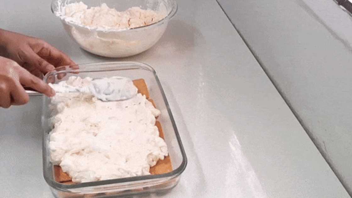 Spreading marshmallow filling on biscuits Spreading marshmallow filling on biscuits