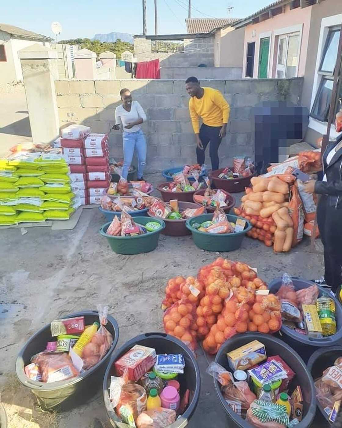 Twins celebrate 21st bday by giving 21 families a month's groceries