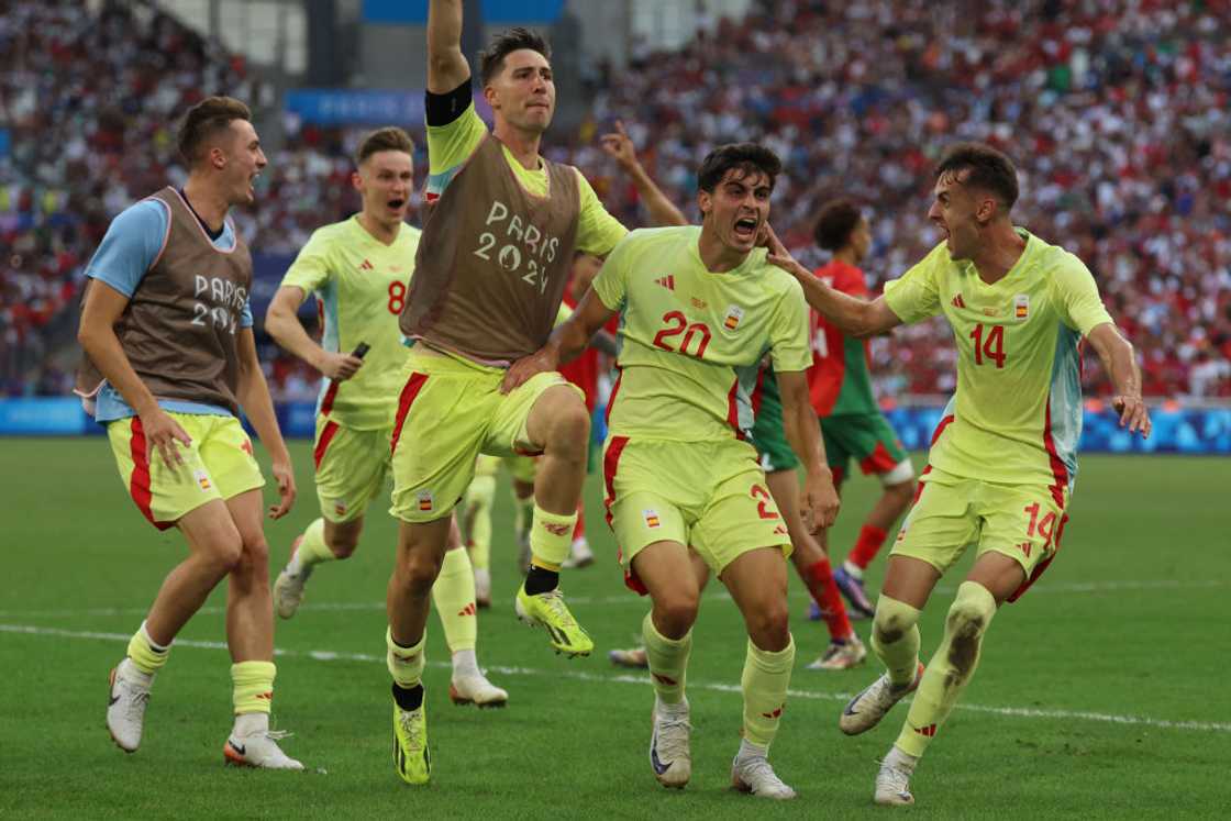 Spain's players celebrating after scoring a goal