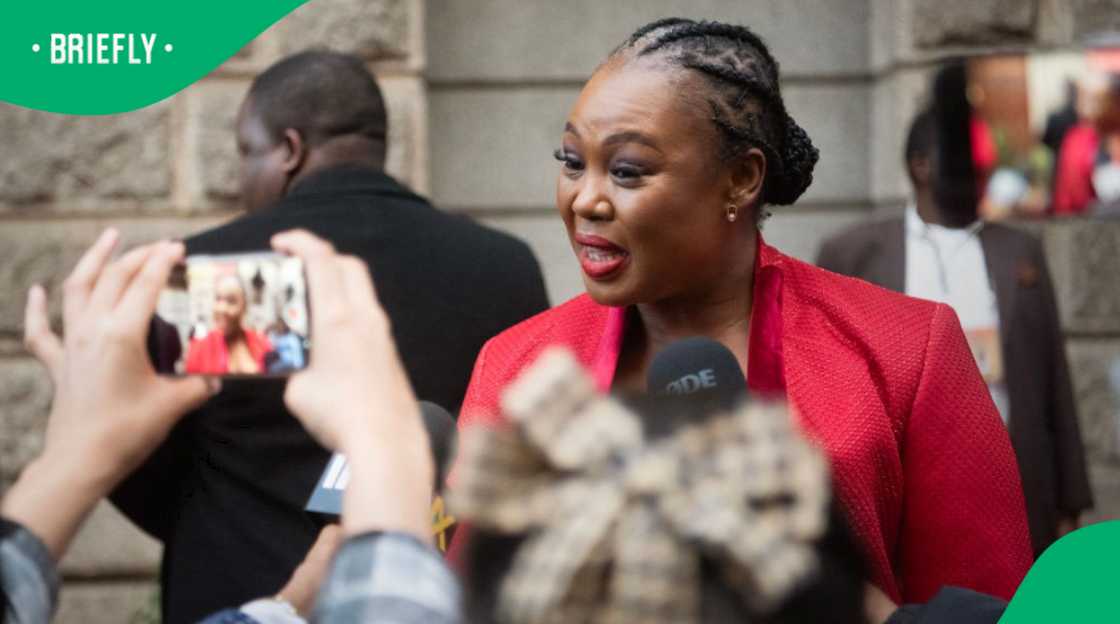 Stella Ndabeni-Abrahams, the Minister of Small Business Development, talks before attending the Opening of Parliament Address at the Cape Town City Hall