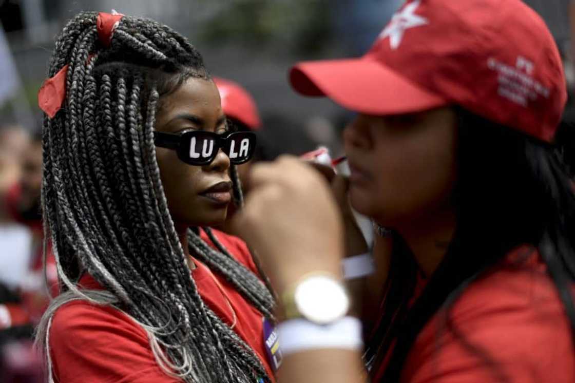 Thousands came dressed in red, the color of Luiz Inacio Lula da Silva's Workers Party Thousands came dressed in red, the color of Luiz Inacio Lula da Silva's Workers Party
