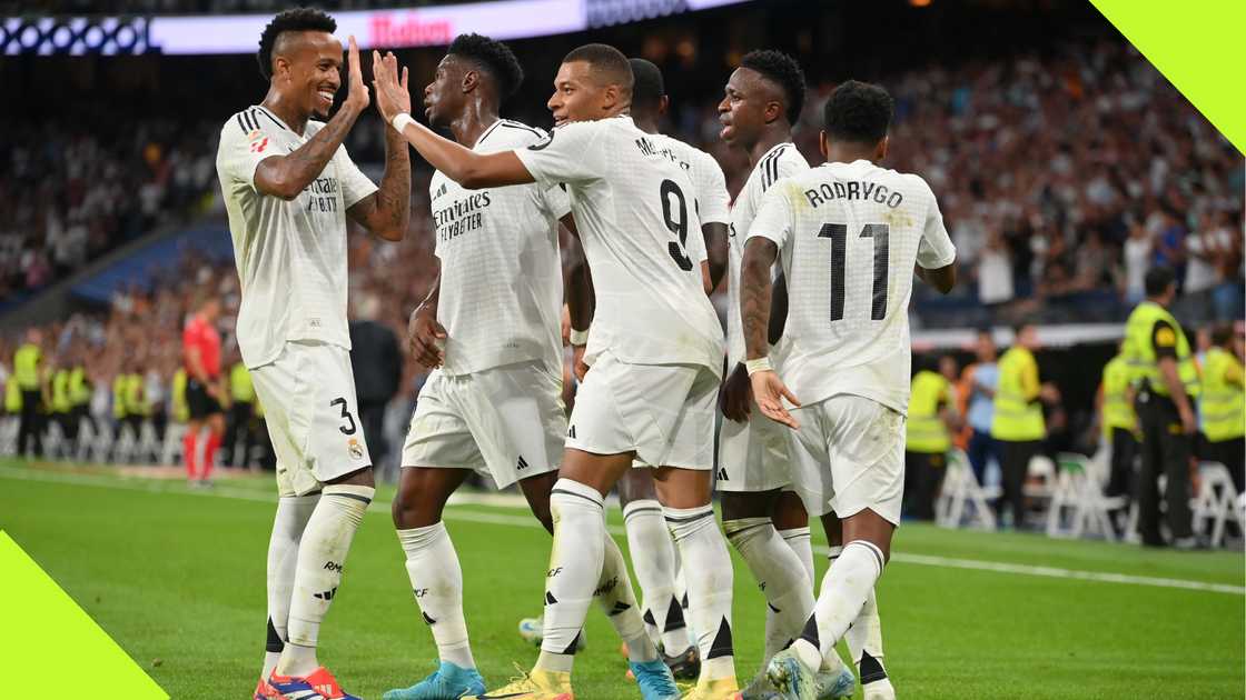 Real Madrid players celebrate with Kylian Mbappe