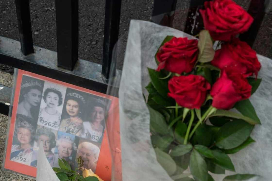 Some people left flowers at the gate of the British embassy in Tokyo