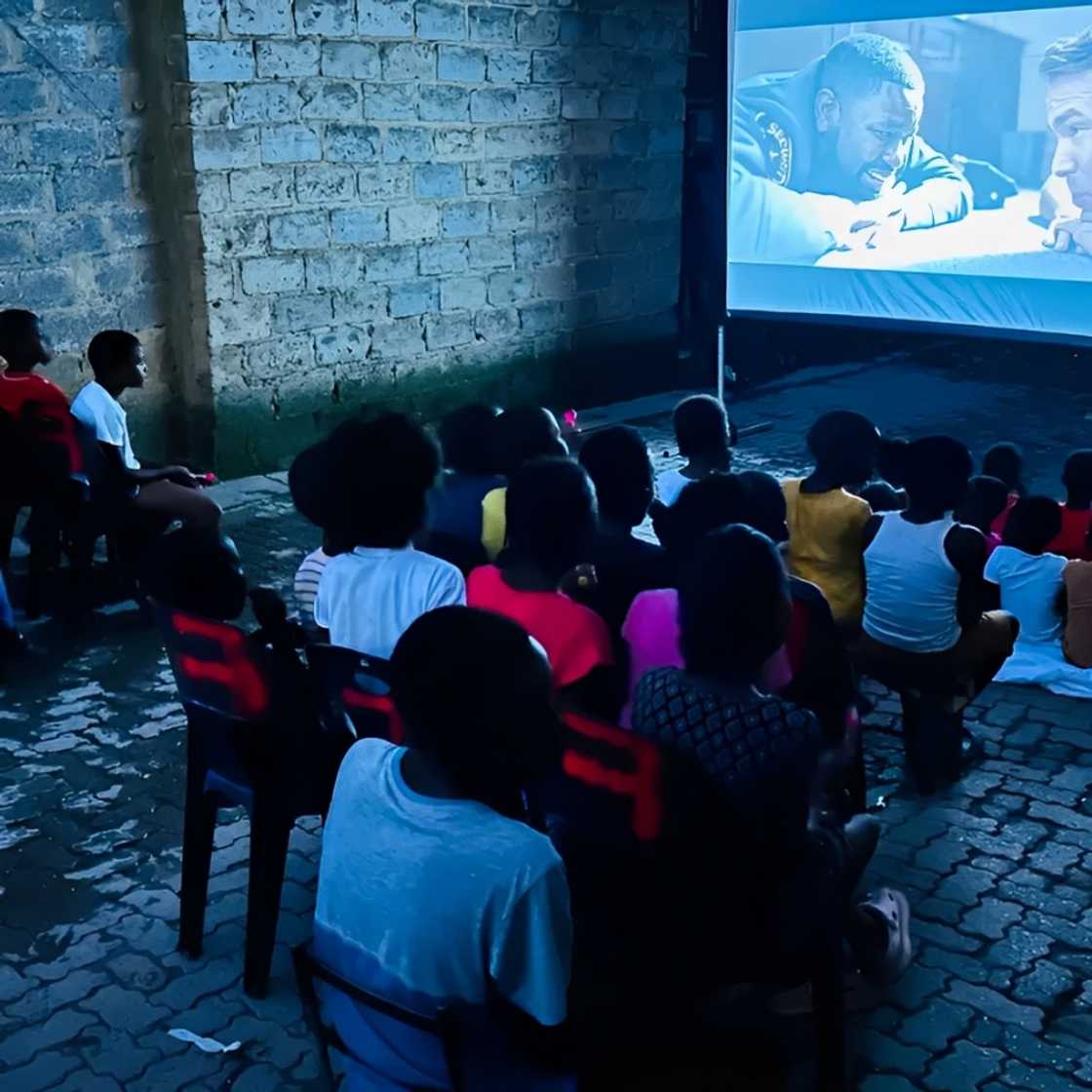 Children enjoying a movie night.