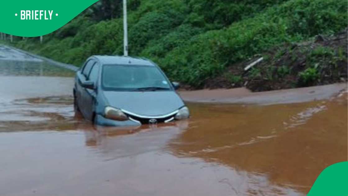 A vehicle entrapped in a mudslide on The Bluff