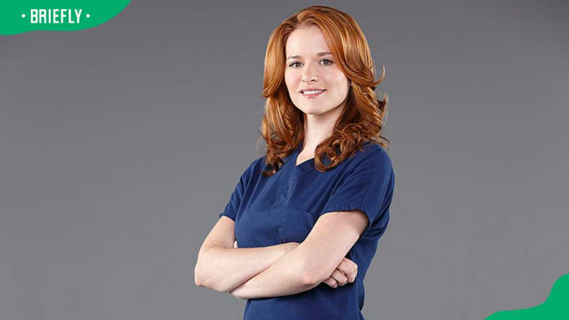 April Kepner from Grey's Anatomy posing while folding her arms