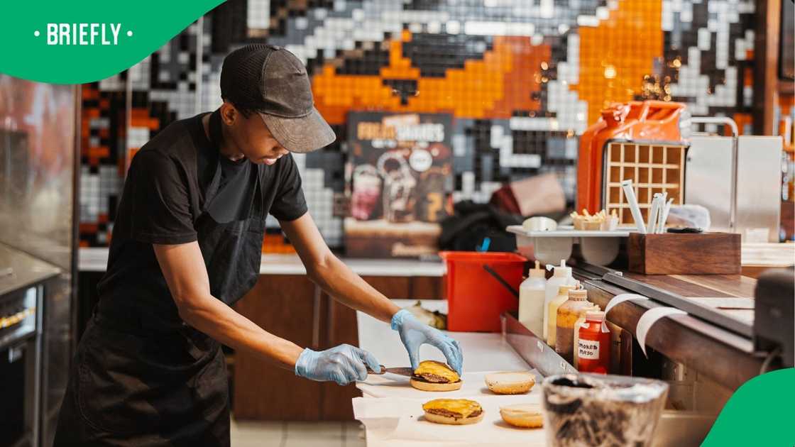 A stock photo of a restaurant employee A stock photo of a restaurant employee