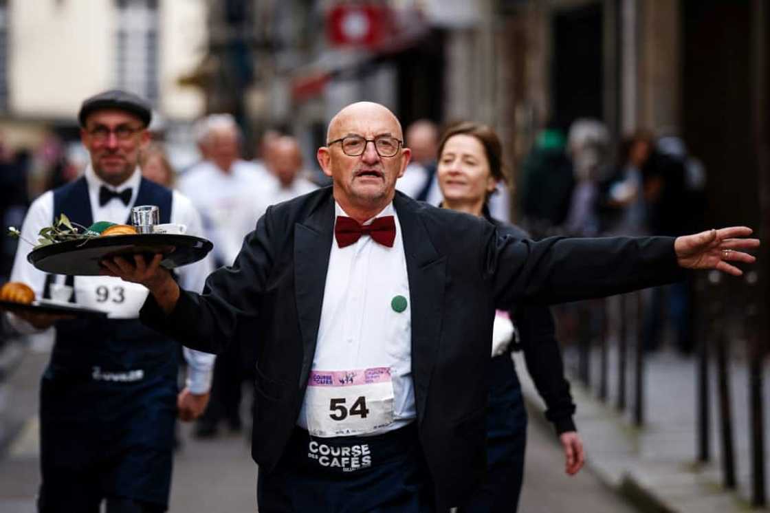 Waiters had to carry a tray of croissant, coffee and water around the course