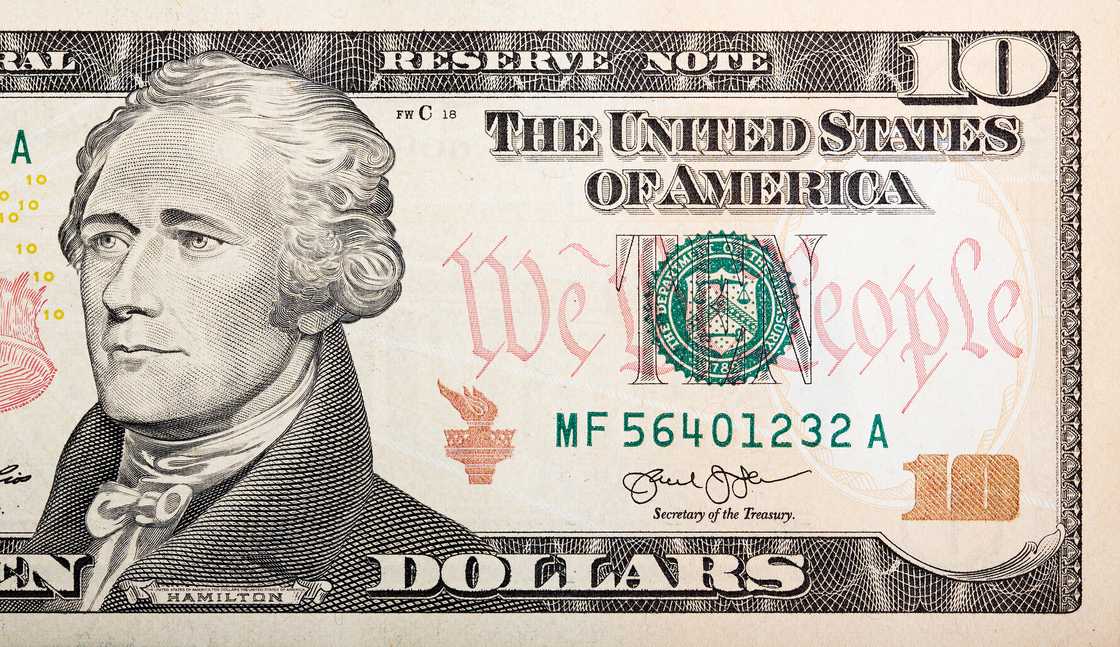 Part of ten-dollar bill American money. Part of ten-dollar bill American money.