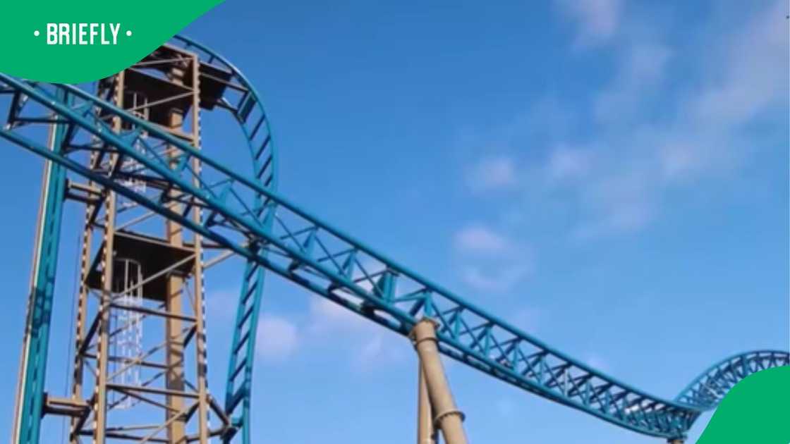 The empty, winding tracks of the roller coaster stretched across the frame, showcasing the steep, twisting path where the students had been riding before the malfunction occurred