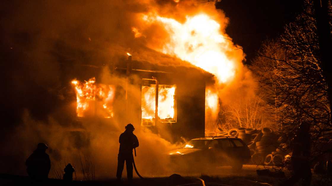 A huge flame razes a house down.
