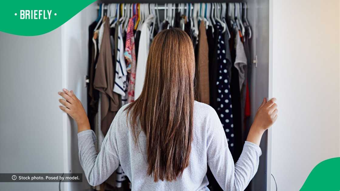 A woman looked at her wardrobe.