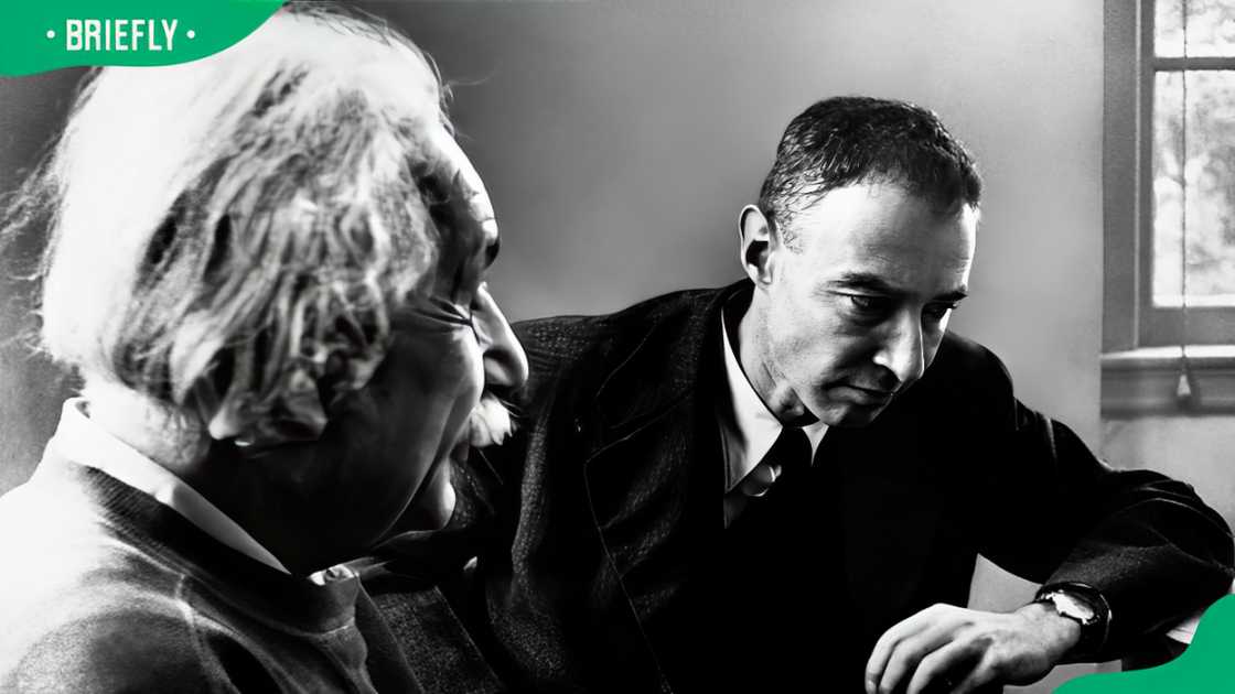 Dr. Robert Oppenheimer (R) listens intently to a discussion by Dr. Albert Einstein regarding matter in terms of space.