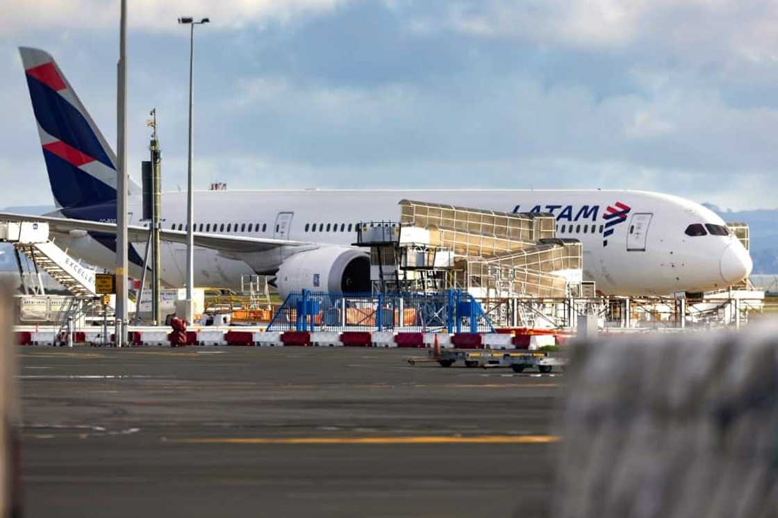 The LATAM Airlines Boeing 787 Dreamliner plane that suddenly lost altitude mid-flight, dropping violently and injuring dozens of travellers, is seen on the tarmac of the Auckland International Airport on March 12, 2024