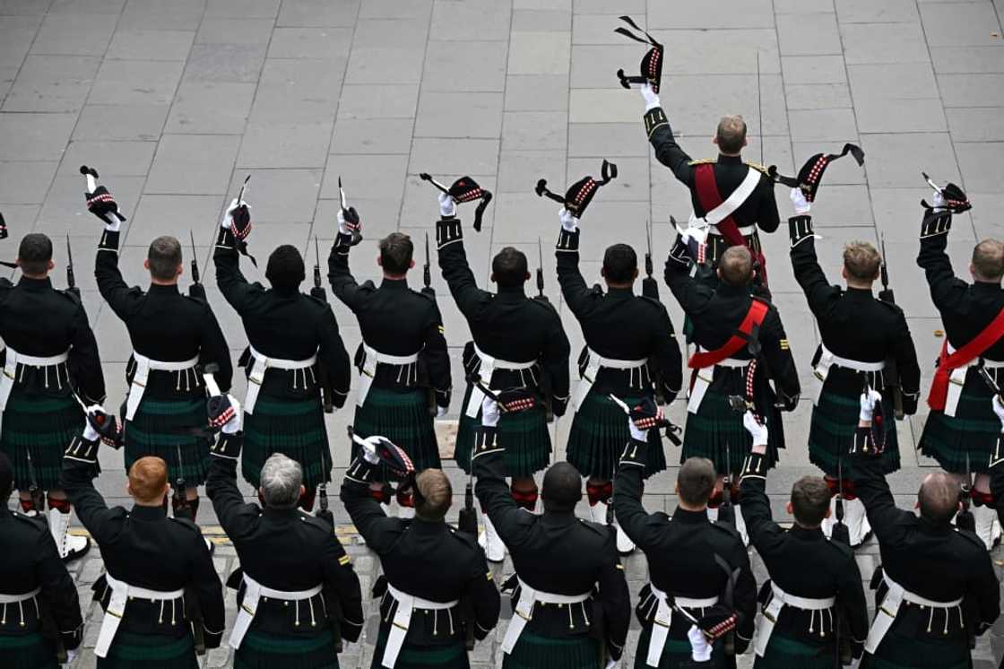 Members of the Royal Regiment of Scotland outside St Giles' Cathedral in Edinburgh