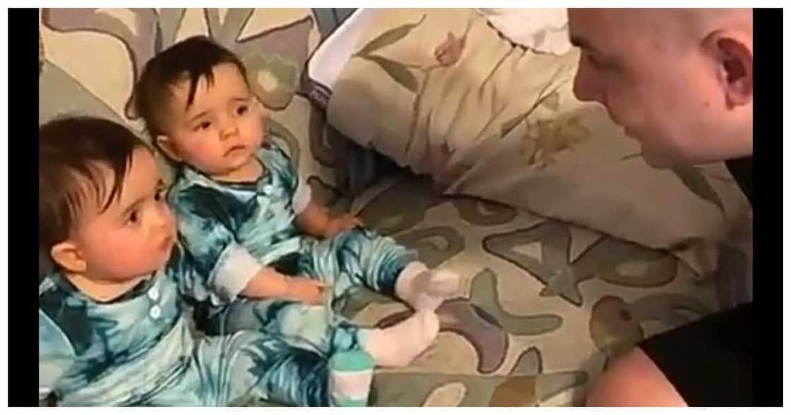 Twin babies light up the internet after reaction on seeing their father's shaved head Twin babies light up the internet after reaction on seeing their father's shaved head