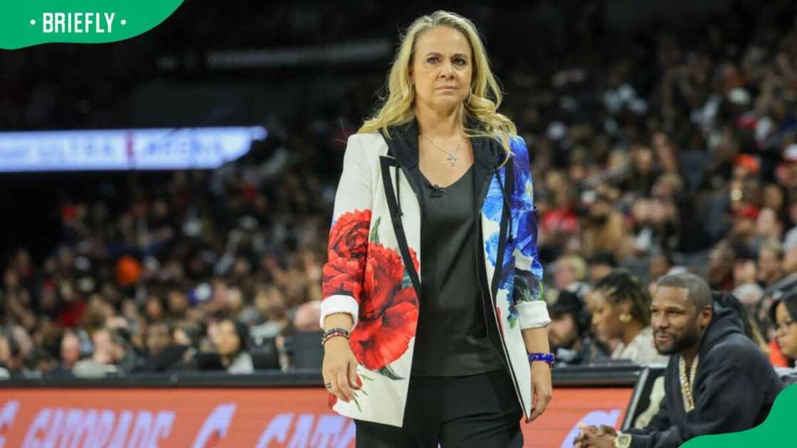 Head coach Becky Hammon of the Las Vegas Aces during a 2024 match against the Phoenix Mercury at Michelob ULTRA Arena Head coach Becky Hammon of the Las Vegas Aces during a 2024 match against the Phoenix Mercury at Michelob ULTRA Arena