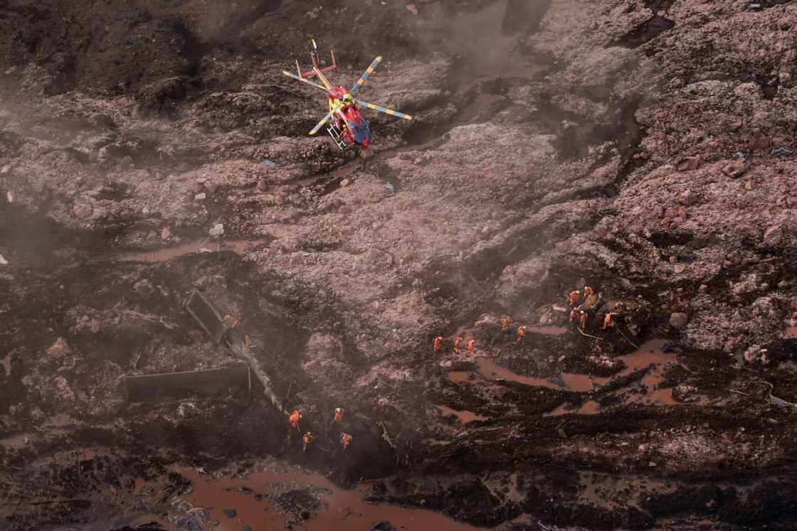 Rescue workers searching for victims after the spill Rescue workers searching for victims after the spill