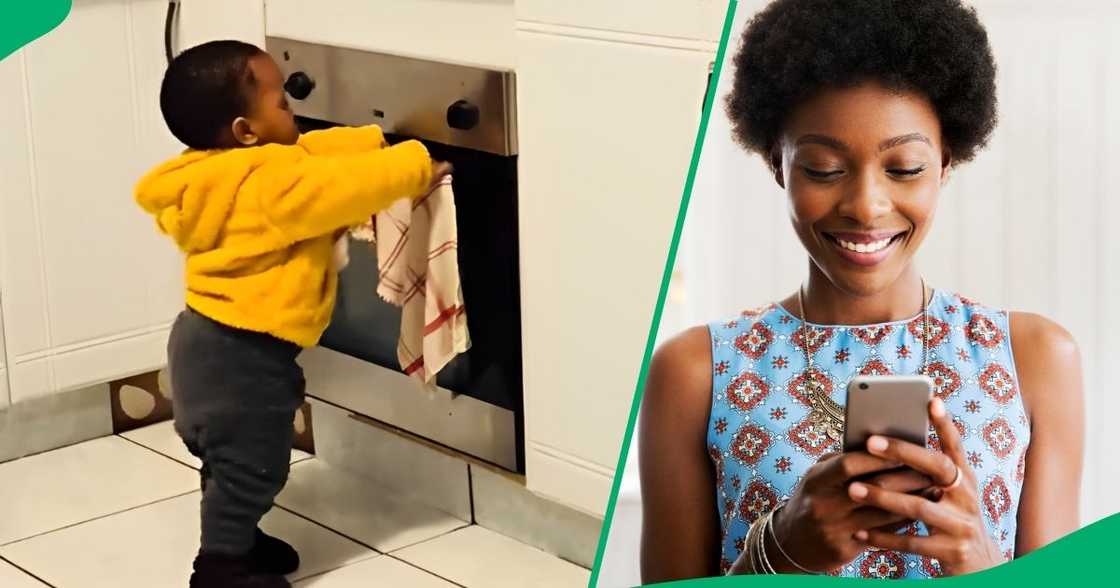 An adorable toddler helped his mother in the kitchen with dishes.