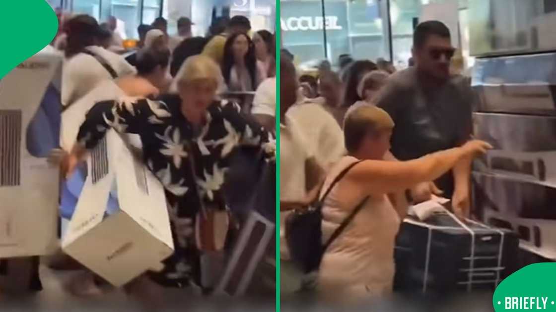 Multiple people ran inside the store, pushing each other to get air conditioners Multiple people ran inside the store, pushing each other to get air conditioners