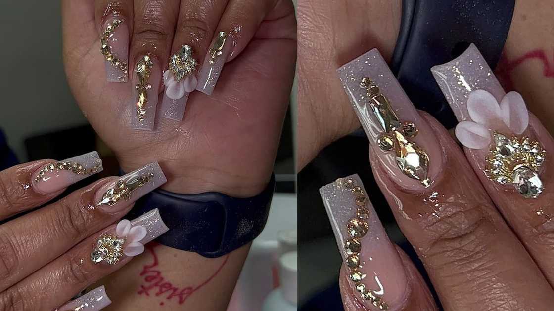 Clear nails with gold bling and white florals Clear nails with gold bling and white florals