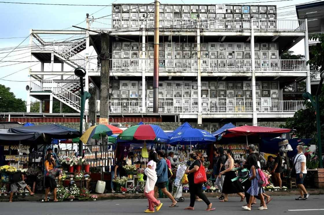 People began lining up before dawn to enter graveyards in Manila