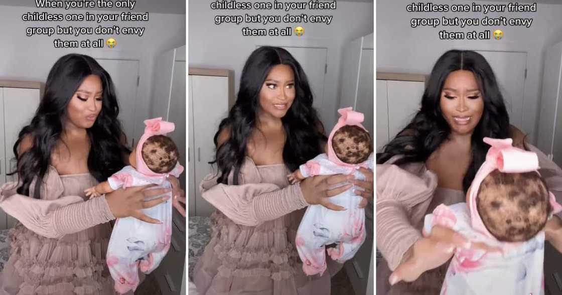 A lady holding a baby doll weirdly to prove that she is not ready to be a mother is going viral on TIkTok A lady holding a baby doll weirdly to prove that she is not ready to be a mother is going viral on TIkTok