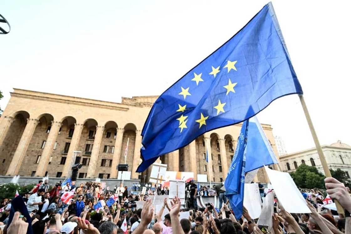 Waving Georgian and EU flags, demonstrators sang the national anthem as many held placards that read 'We are Europe'.