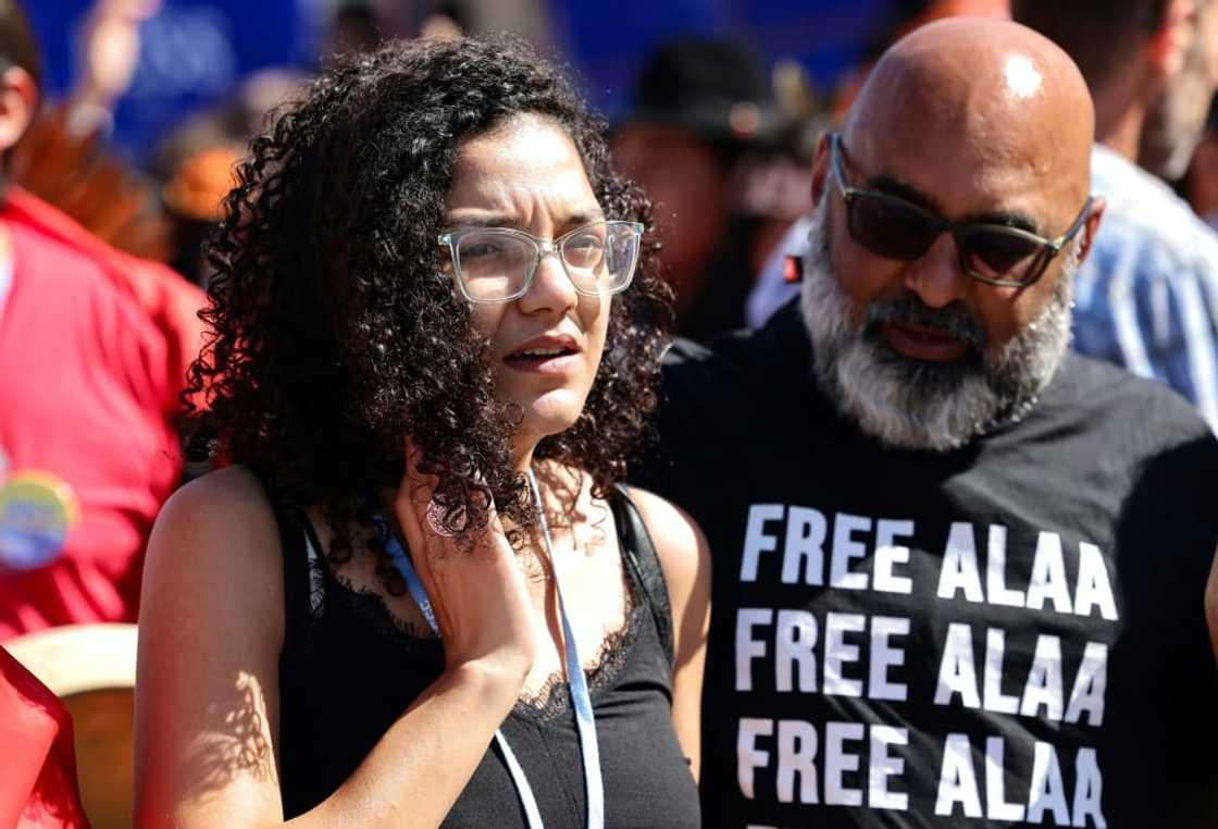 Hundreds marched behind Sanaa Seif (L)