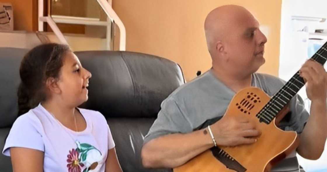 9 year old sings Whitney Houston song with grandfather