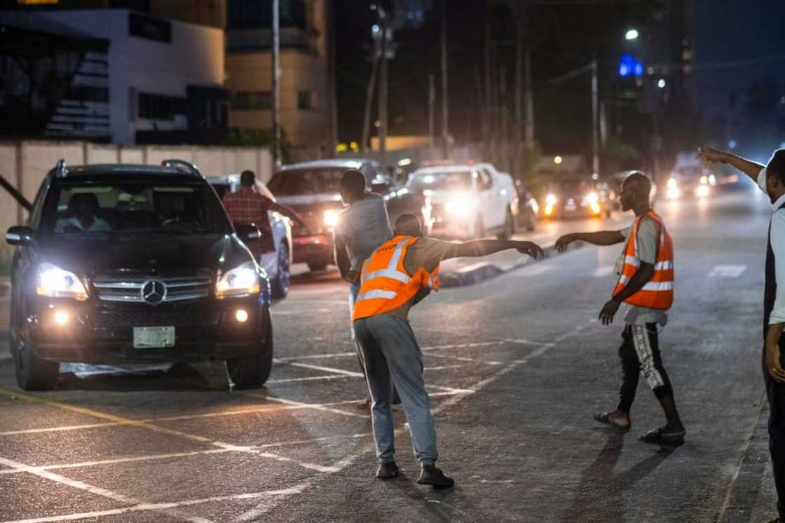 In the wealthy Ikoyi neighbourhood, the flow of people chasing money never stops