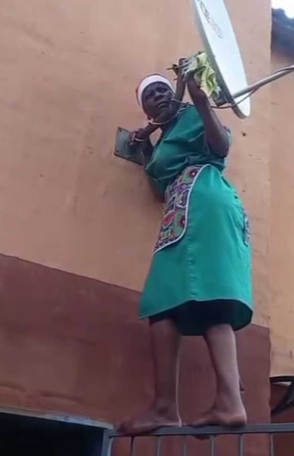 A domestic worker cleaned the DSTV dish in a skit that amused South Africans online. A domestic worker cleaned the DSTV dish in a skit that amused South Africans online.