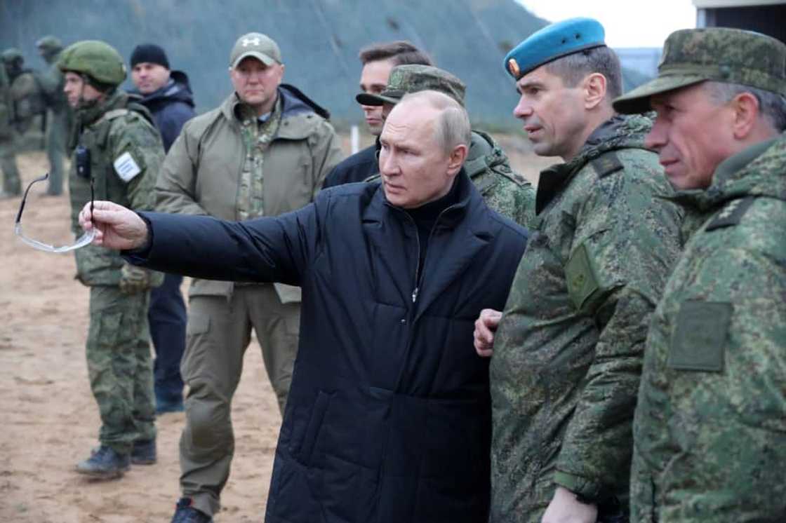Russian President Vladimir Putin meets soldiers during his  visit to a military training centre on Thursday Russian President Vladimir Putin meets soldiers during his  visit to a military training centre on Thursday