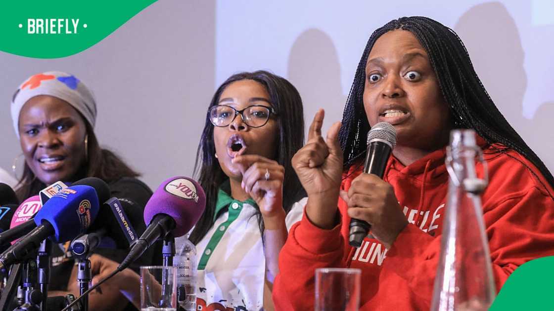 Leader of the anti-illegal immigration group "March and March" movement Jacinta Ngobese-Zuma (C) reacts while conducting a joint press conference with leaders of various civic organisations in Midrand on June 24, 2026