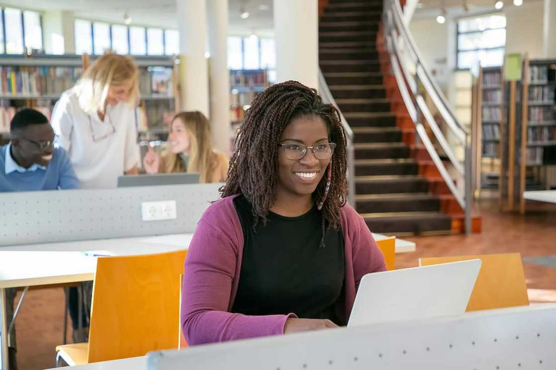 Multi-Ethnic students in a library Multi-Ethnic students in a library