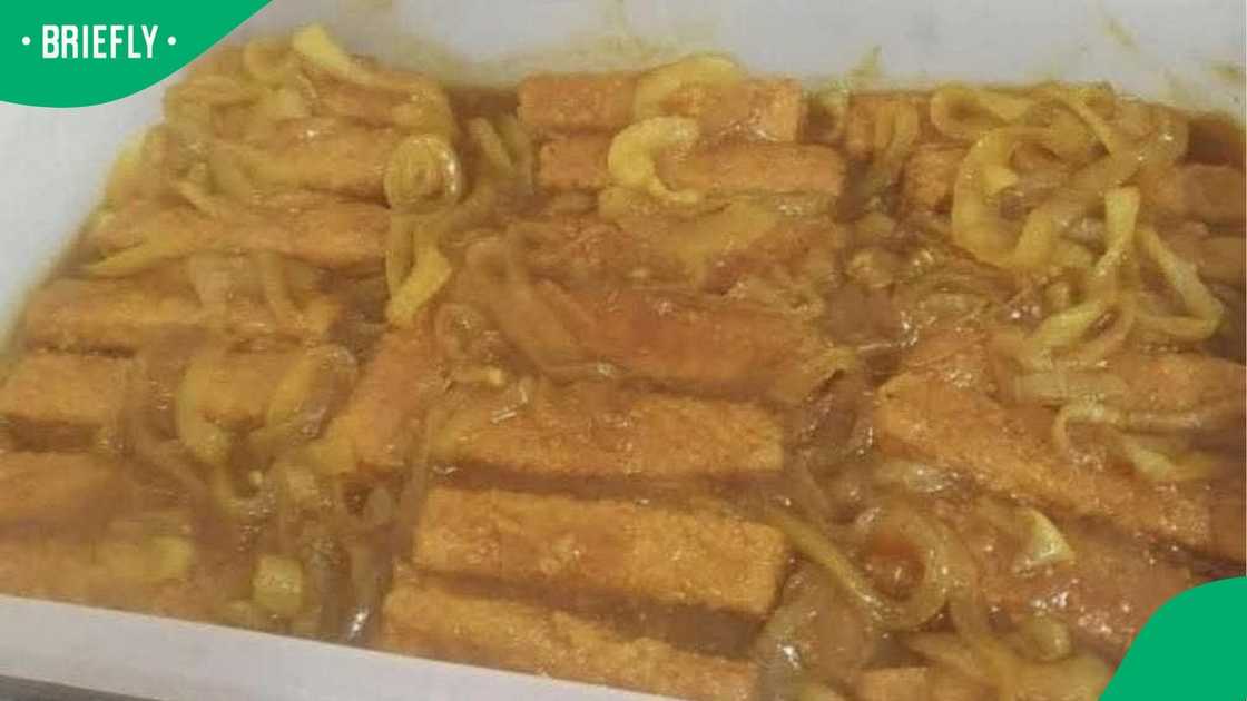 Fish fingers and pickled onions in a dish. Fish fingers and pickled onions in a dish.