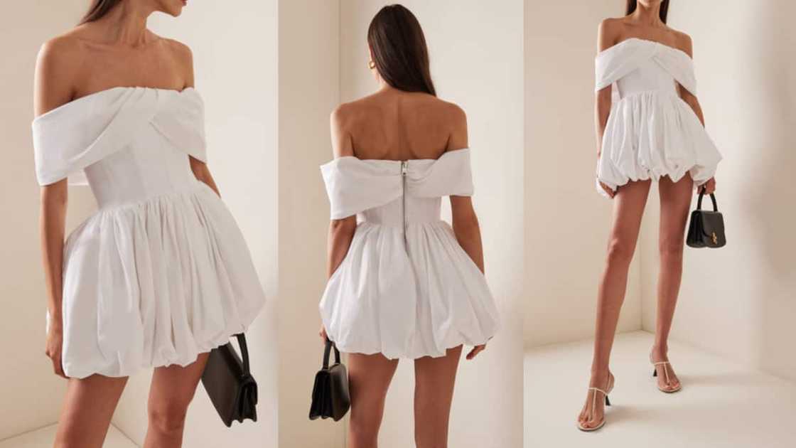 Off-shoulder cotton-poplin mini with a flouncy bubble skirt and off-shoulder drapes Off-shoulder cotton-poplin mini with a flouncy bubble skirt and off-shoulder drapes