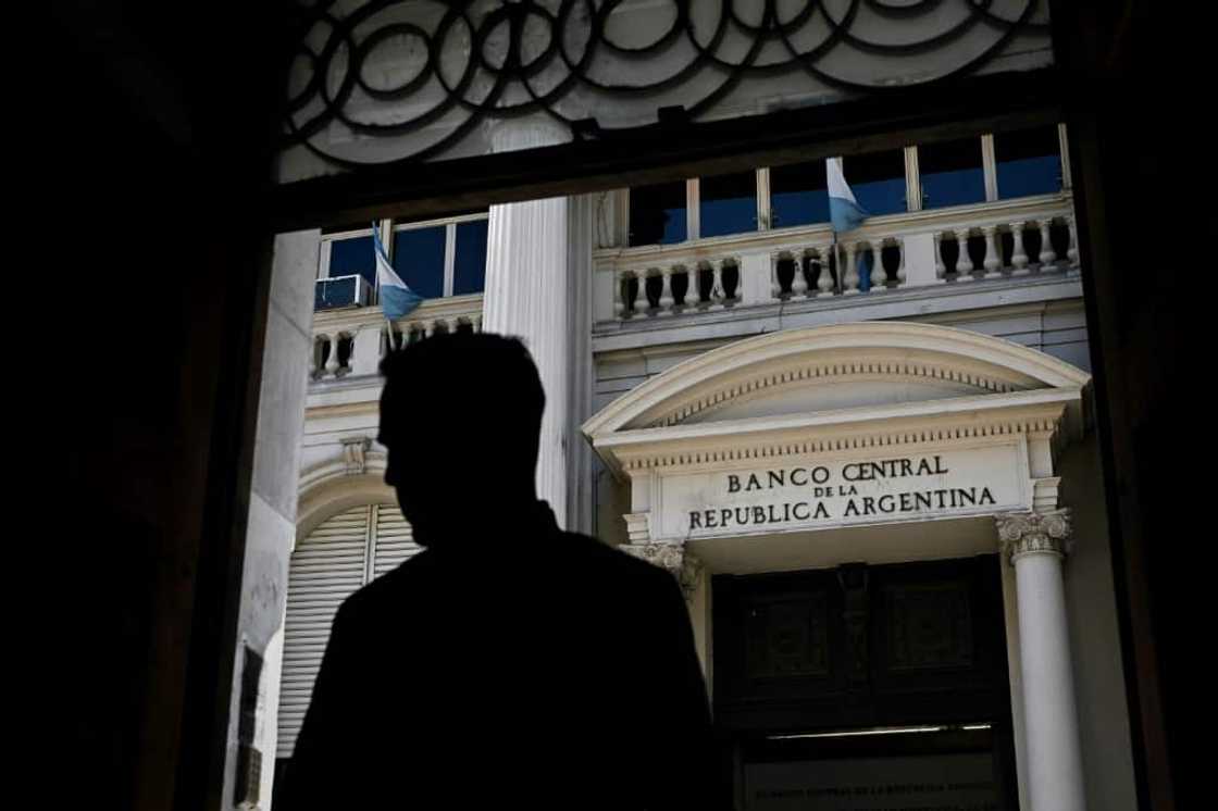 A man stands in front of Argentina's Central Bank in Buenos Aires, May 15, 2023. Year-on-year inflation in the South American country hit almost 109 percent in April