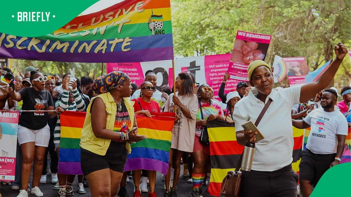 People attending a Pride event. People attending a Pride event.