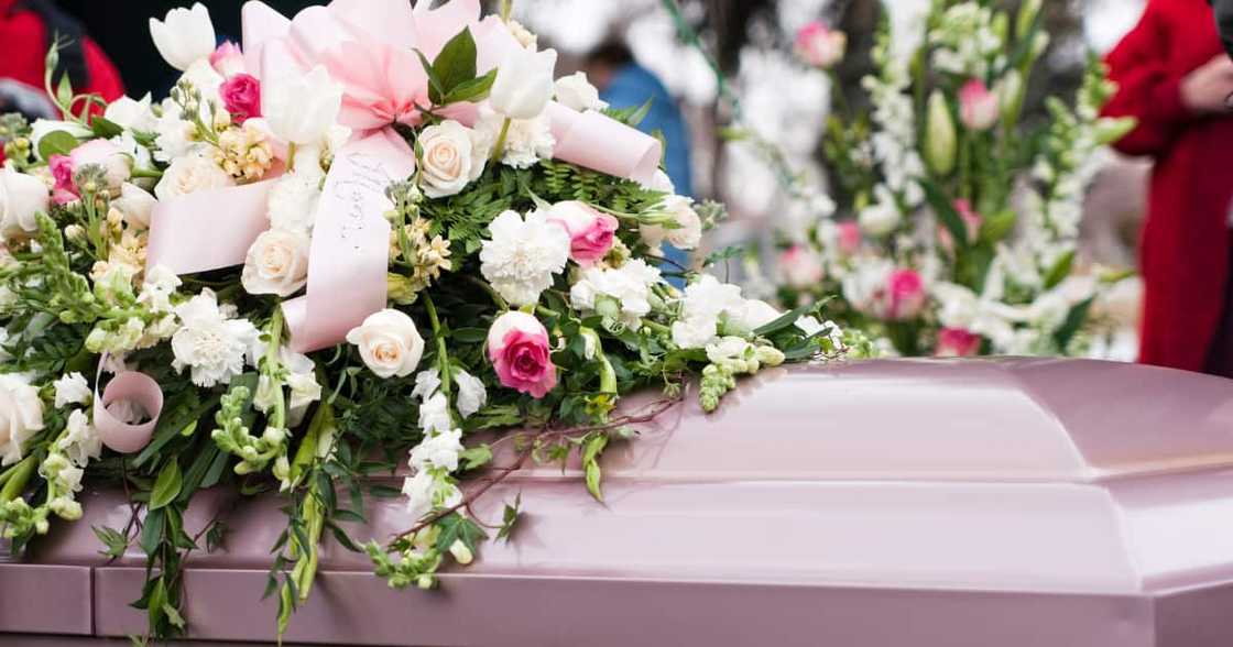Picture of a casket at a funeral Picture of a casket at a funeral