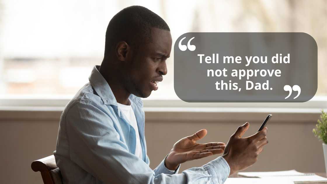 An angry young man pointing at his smartphone