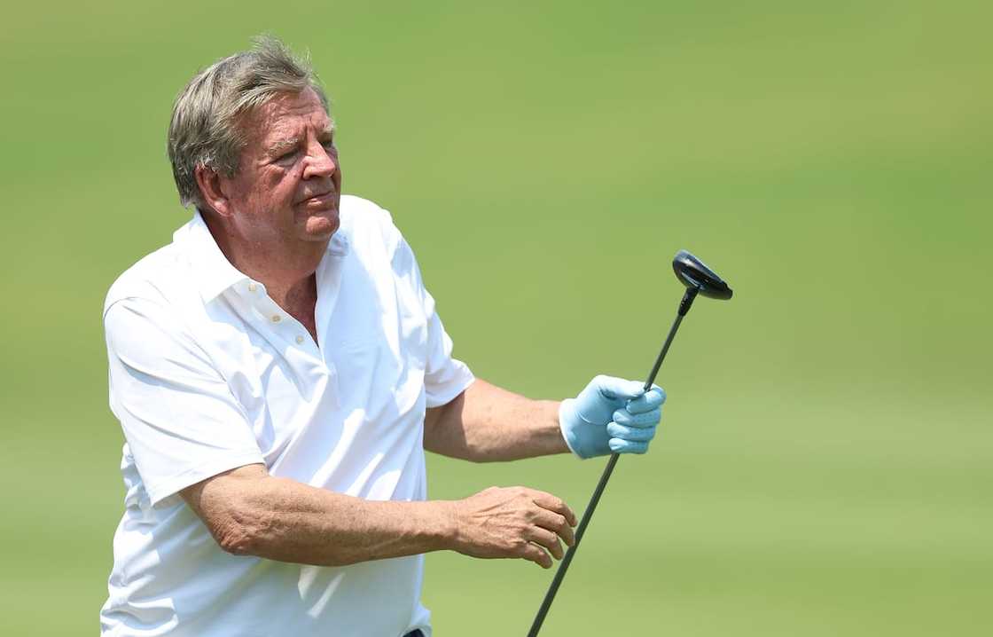 Businessman Johann Rupert playing golf