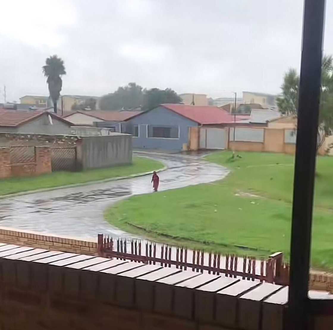 A kid walking in the rain left South Africans feeling emotional.