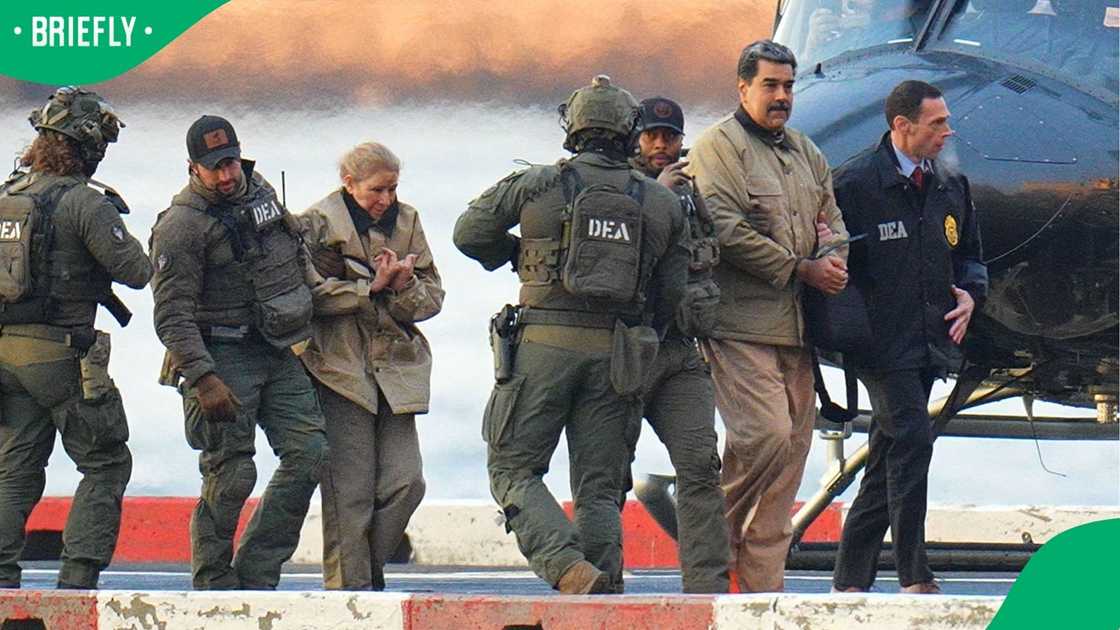 Nicolas Maduro and his wife, Cilia Flores being escorted by US forces