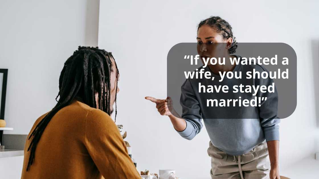 A woman points while speaking to another person seated at a table. A woman points while speaking to another person seated at a table.