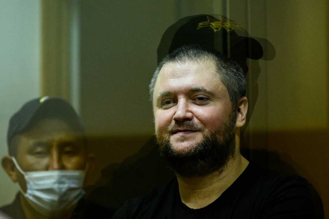Former Russian policeman Vladimir Vorontsov, seen here in court in 2020, was jailed on Tuesday
, stands inside a defendants' cage during a court hearing in Moscow on July 2, 2020.Supporters of the 35-year-old, with blue eyes and a stocky build, say that the real reason for his arrest is his Police Ombudsman project, a series of linked social media accounts dedicated to protecting police officers' rights and exposing abuse by their higher-ups. His case has sparked a rare public outcry among police, a key pillar of President Vladimir Putin's rule, that could eventually spell trouble for the Kremlin, observers say. Former Russian policeman Vladimir Vorontsov, seen here in court in 2020, was jailed on Tuesday
, stands inside a defendants' cage during a court hearing in Moscow on July 2, 2020.Supporters of the 35-year-old, with blue eyes and a stocky build, say that the real reason for his arrest is his Police Ombudsman project, a series of linked social media accounts dedicated to protecting police officers' rights and exposing abuse by their higher-ups. His case has sparked a rare public outcry among police, a key pillar of President Vladimir Putin's rule, that could eventually spell trouble for the Kremlin, observers say.