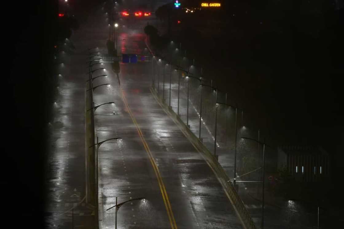 Heavy rain from Typhoon Noru falls on an empty road in Danang, in central Vietnam where the storm made landfall before dawn on September 28, 2022 Heavy rain from Typhoon Noru falls on an empty road in Danang, in central Vietnam where the storm made landfall before dawn on September 28, 2022