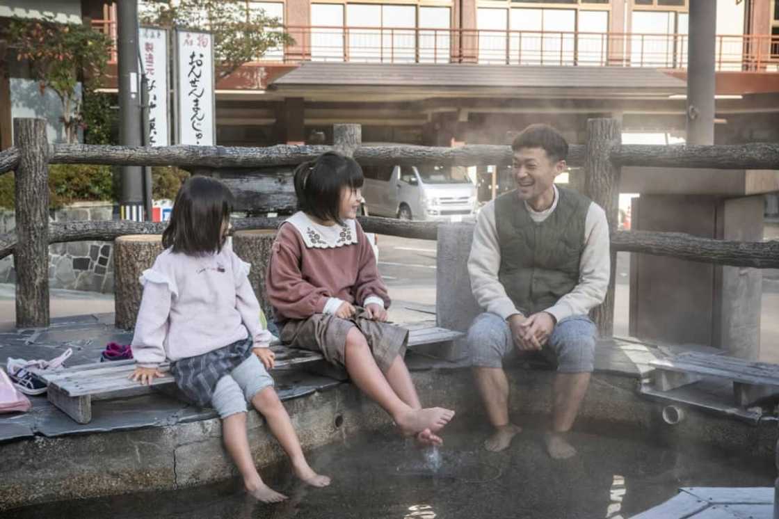 The baths at Tsuchiyu Onsen are nestled between green mountains along a winding river in Fukushima The baths at Tsuchiyu Onsen are nestled between green mountains along a winding river in Fukushima