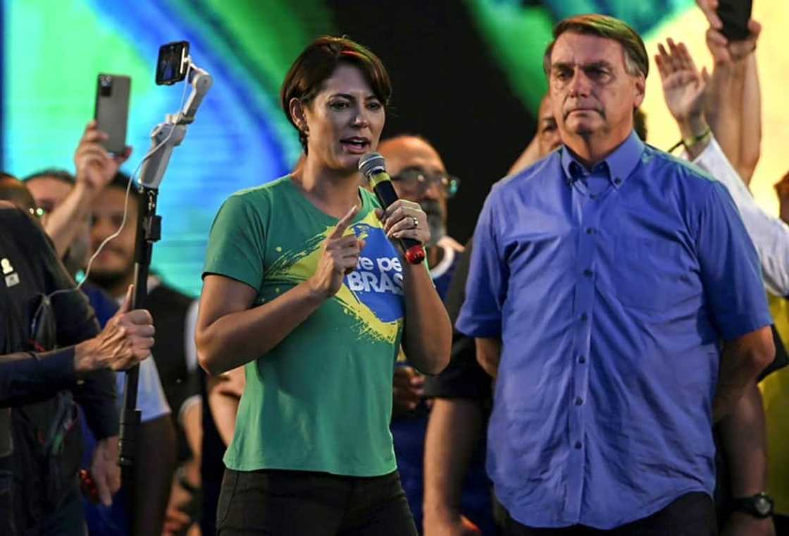 President Bolsonaro listens to his wife Michelle Bolsonaro during the March for Jesus Christ event in Rio de Janeiro, Brazil President Bolsonaro listens to his wife Michelle Bolsonaro during the March for Jesus Christ event in Rio de Janeiro, Brazil