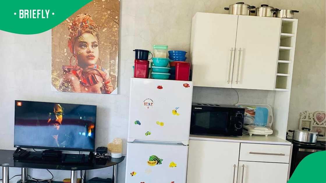 A woman showed off her one-room home. A woman showed off her one-room home.